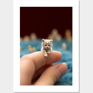 tiny kitten on finger Posters and Art